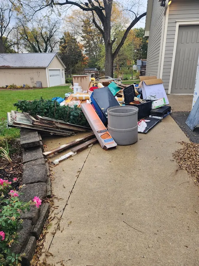 Dumpster being loaded with debris for Commercial Dumpster Rental in Old Stine